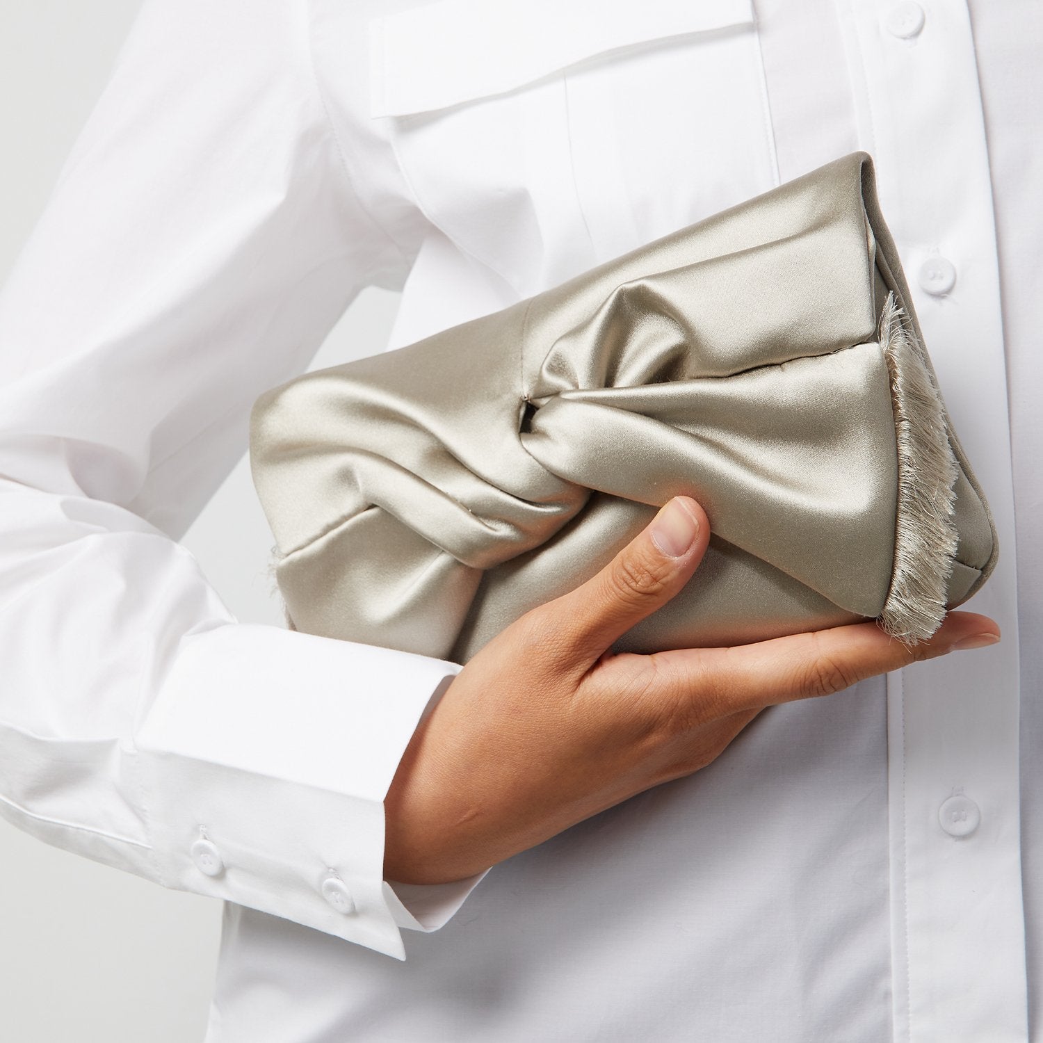 Bow Clutch -

                  
                    Satin in SIlver -
                  

                  Anya Hindmarch US
