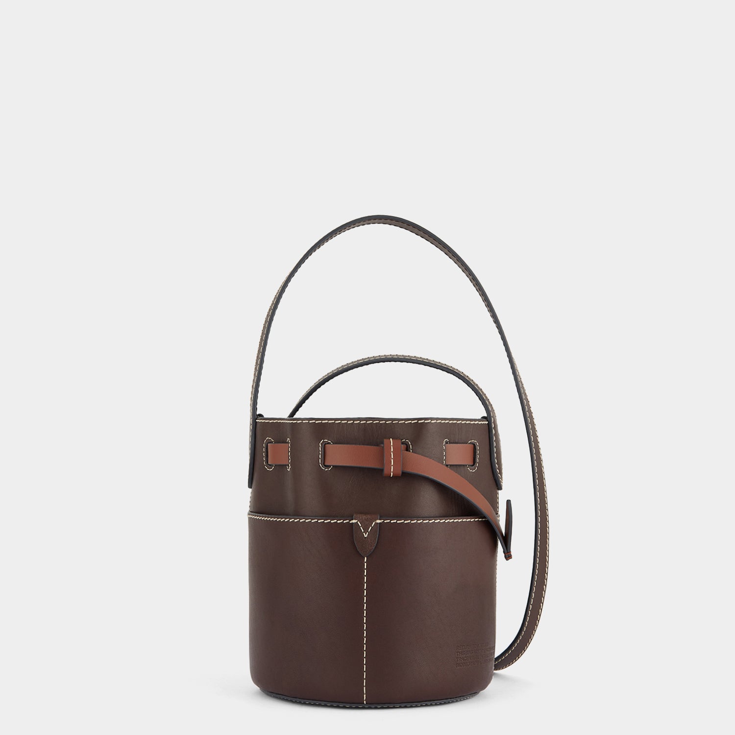 Return to Nature Mini Bucket Bag -

                  
                    Compostable Leather in Cigar -
                  

                  Anya Hindmarch US
