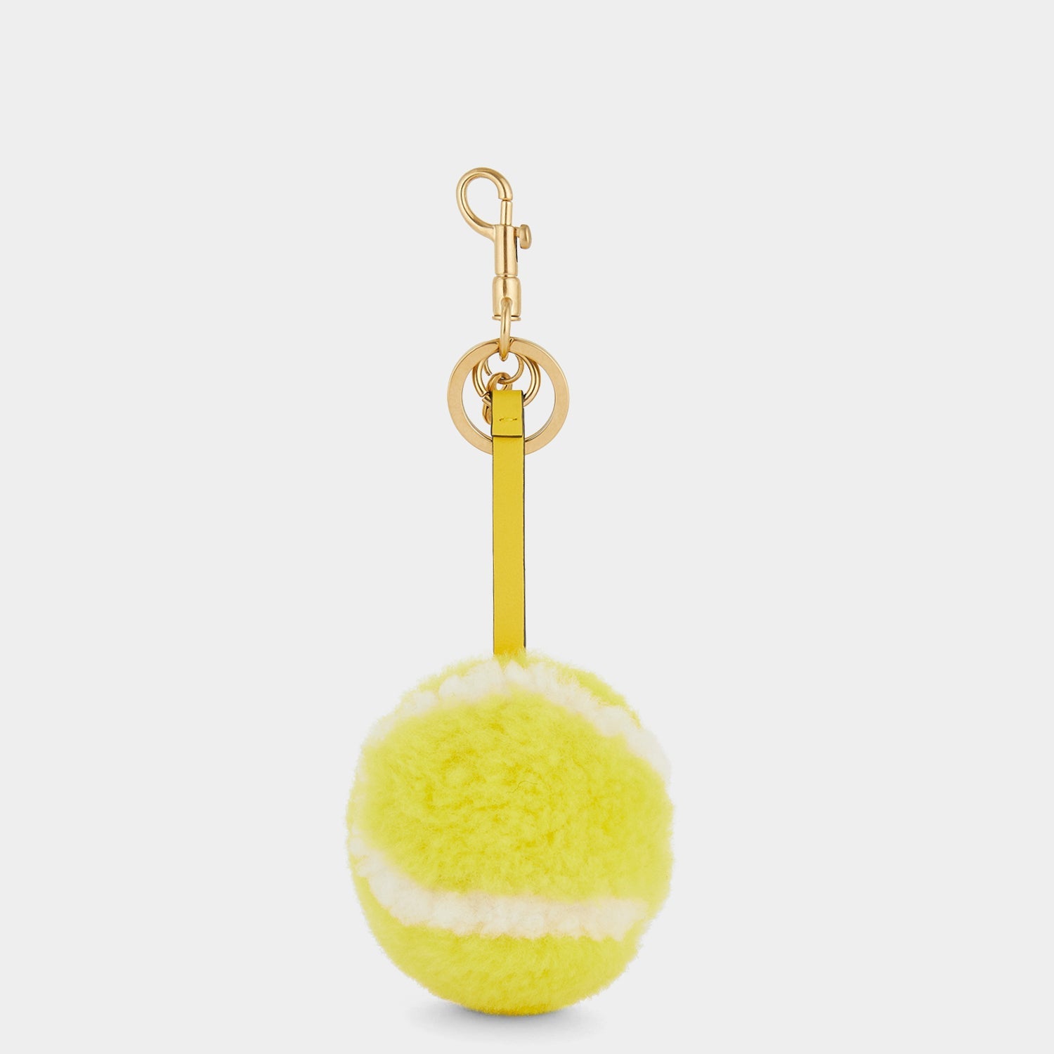 Tennis Charm -

                  
                    Shearling in Bright Lemon -
                  

                  Anya Hindmarch US
