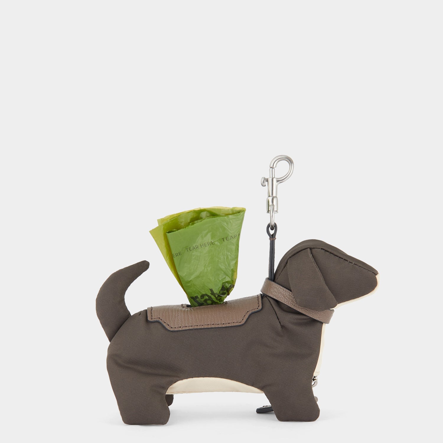 Dog Poo Bag Charm -

                  
                    Regenerated ECONYL® in Taupe -
                  

                  Anya Hindmarch US
