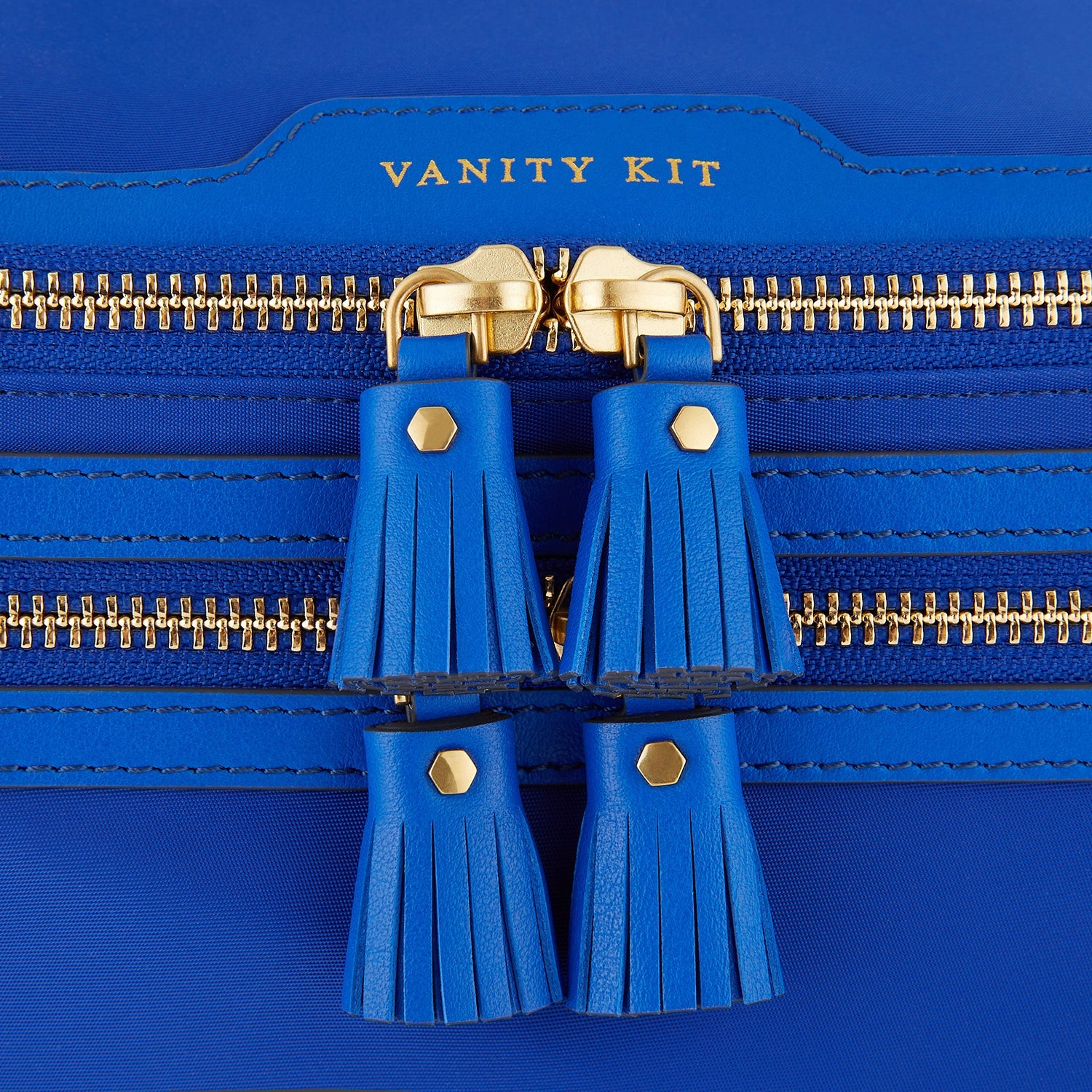 Vanity Kit -

                  
                    ECONYL® regenerated nylon in Electric Blue -
                  

                  Anya Hindmarch US
