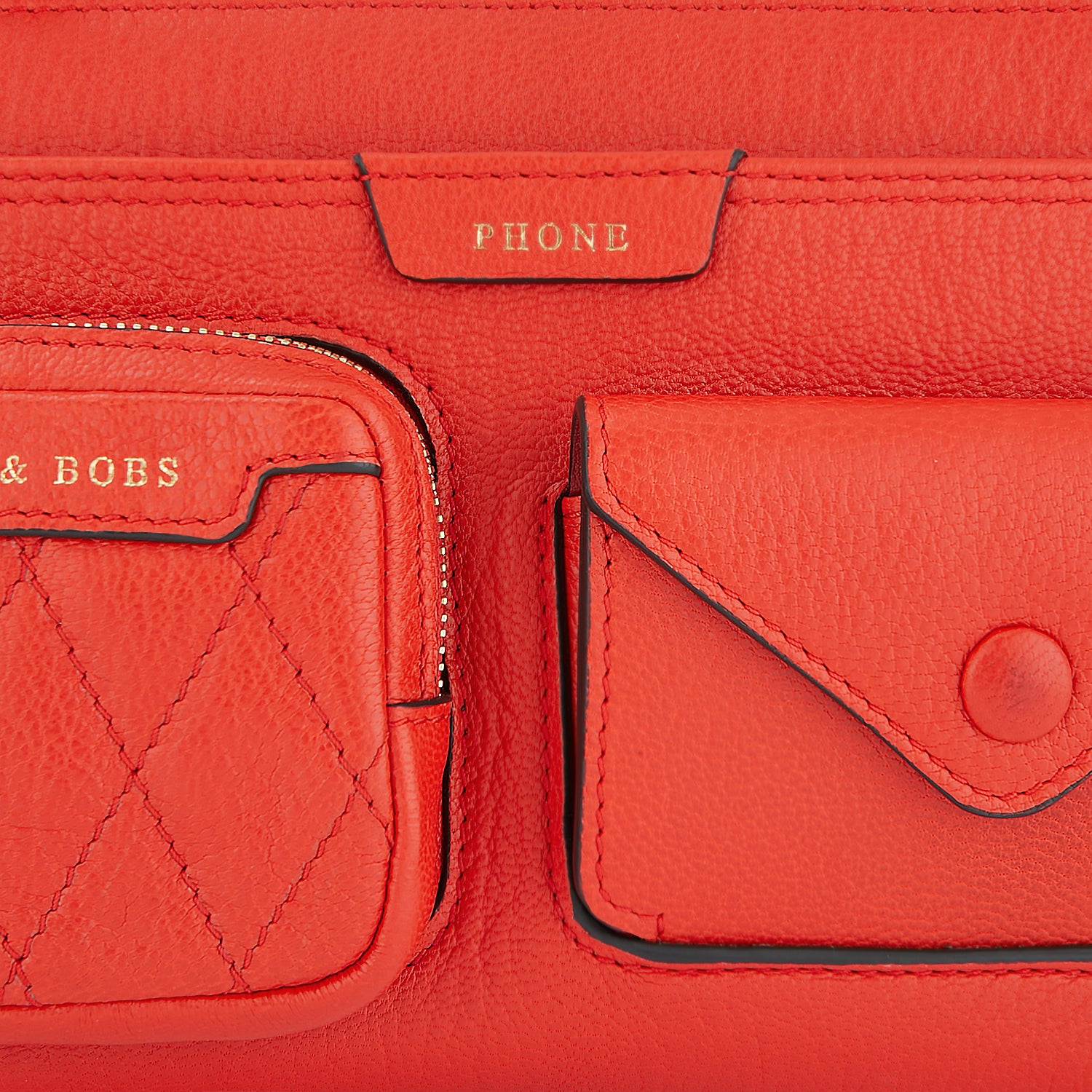 Multi Pocket Pouch on Strap -

                  
                    Shiny Grain Leather in Flame Red -
                  

                  Anya Hindmarch US
