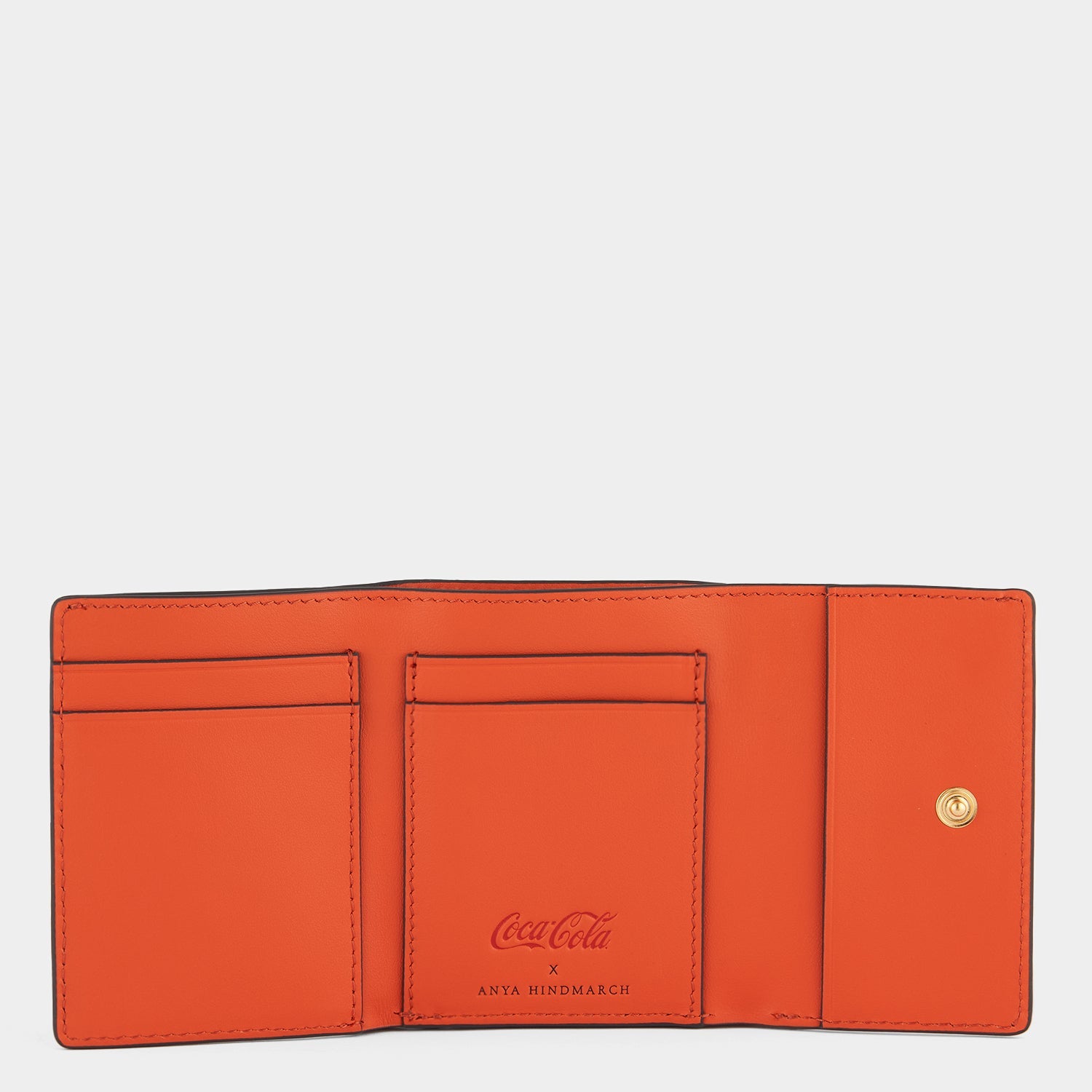 Anya Brands Fanta Mini Trifold Zip Wallet -

                  
                    Capra Leather in Clementine -
                  

                  Anya Hindmarch US
