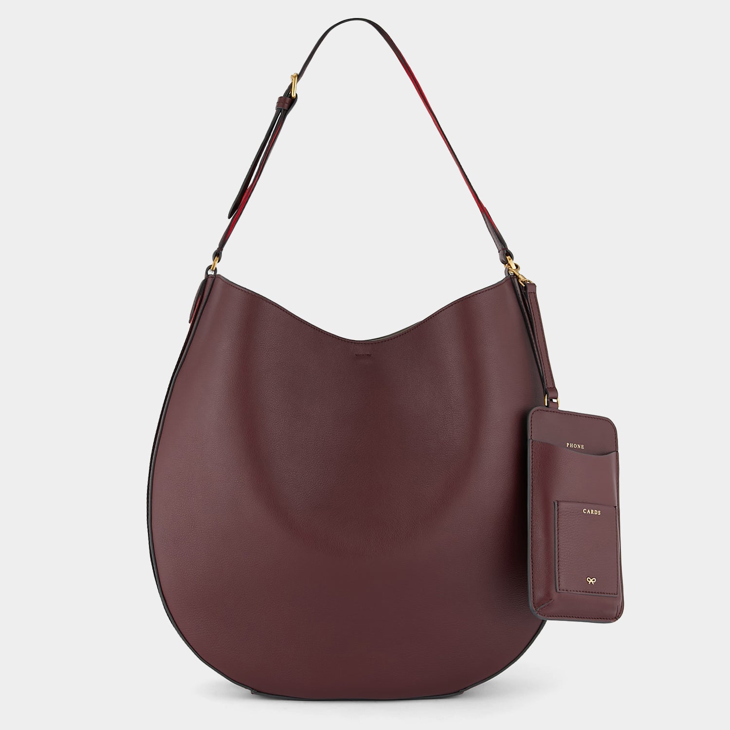 Nastro Hobo -

                  
                    Flat Leather in Medium Red -
                  

                  Anya Hindmarch US
