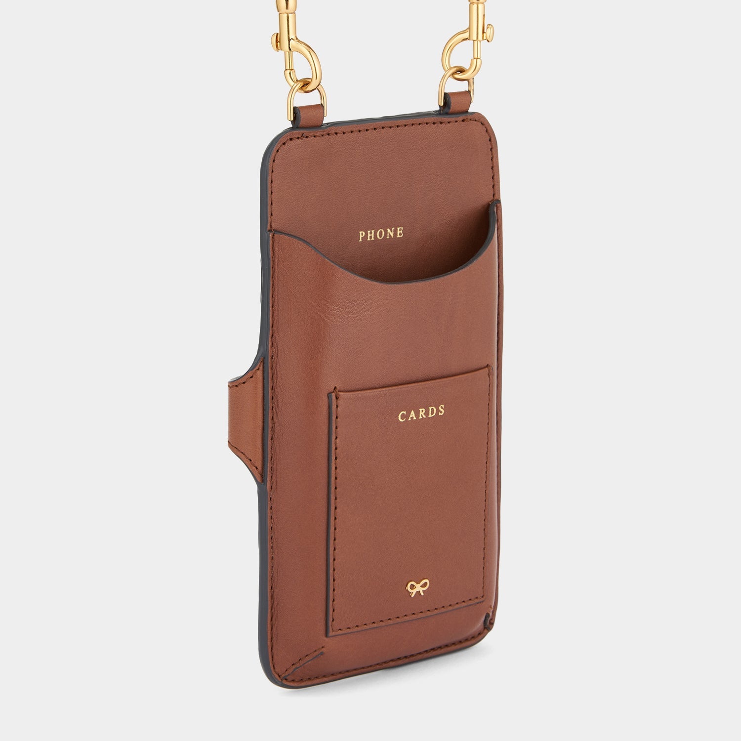 Nastro Phone Pouch on Strap -

                  
                    Flat Leather in Cedar -
                  

                  Anya Hindmarch US
