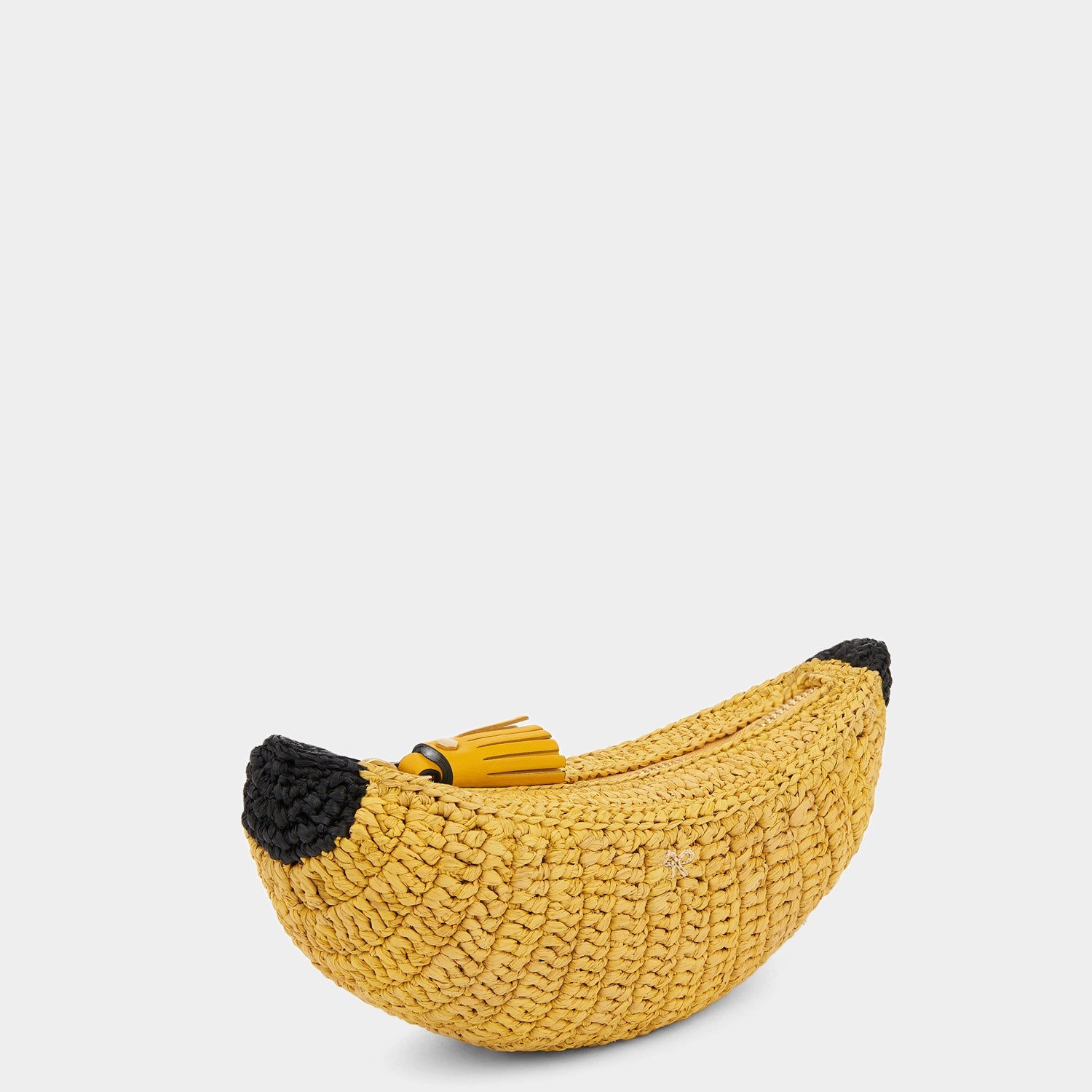 Banana Pouch -

                  
                    Raffia in honey -
                  

                  Anya Hindmarch US
