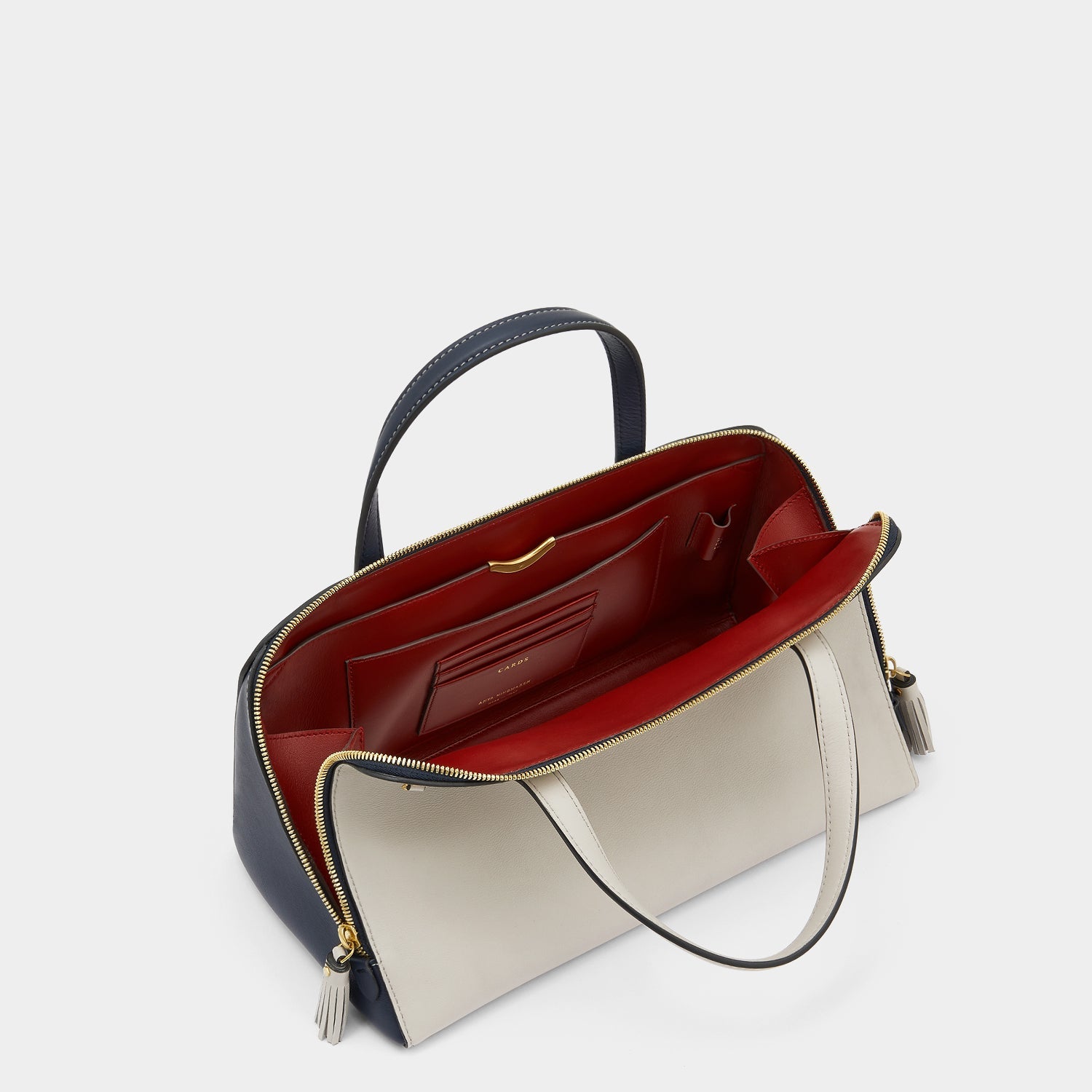 Wedge Cross-body -

                  
                    Calf Leather in Steam -
                  

                  Anya Hindmarch US
