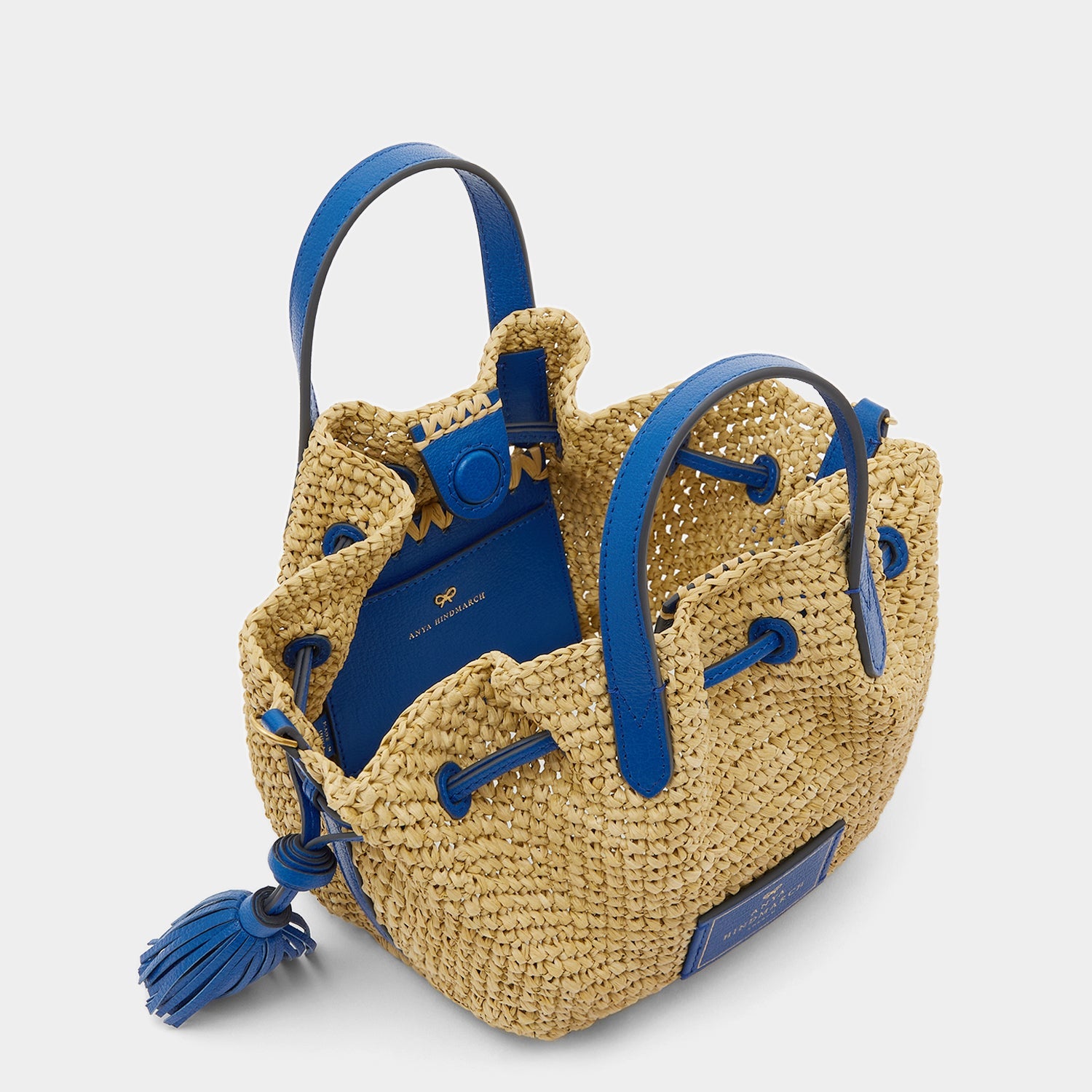Raffia Drawstring Small Tote -

                  
                    Leather in Electric Blue -
                  

                  Anya Hindmarch US
