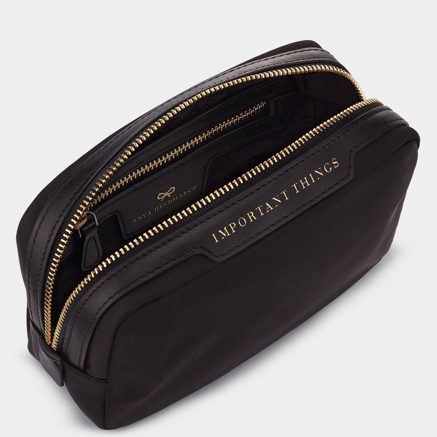 Important Things Pouch -

                  
                    ECONYL® Regenerated Nylon in Black -
                  

                  Anya Hindmarch US
