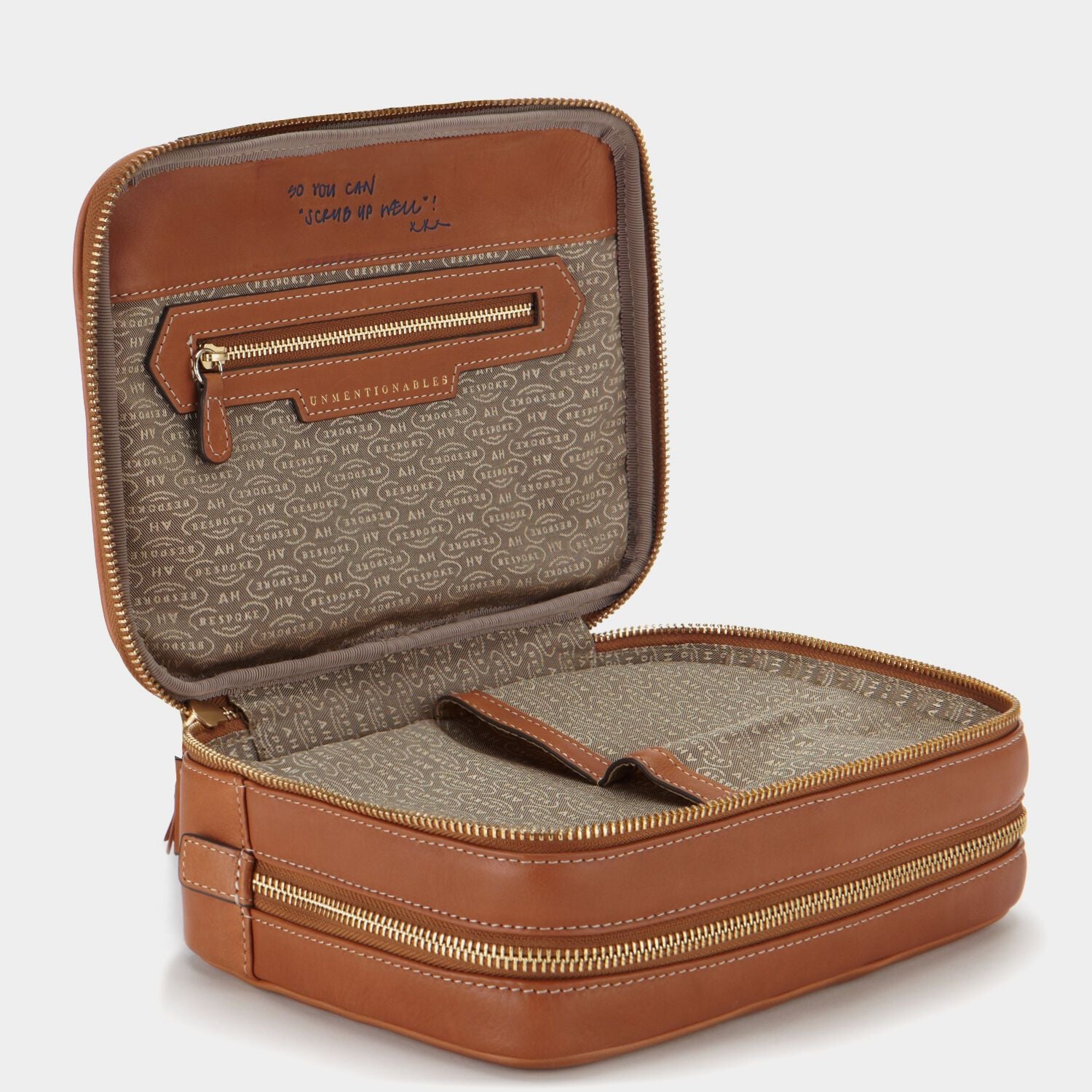 Bespoke Zipped Wash Bag -

                  
                    Butter Leather in Tan -
                  

                  Anya Hindmarch US
