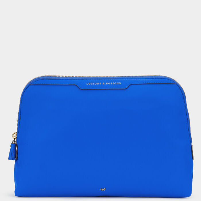 Lotions and Potions Pouch -

                  
                    Econyl® in Electric Blue -
                  

                  Anya Hindmarch US
