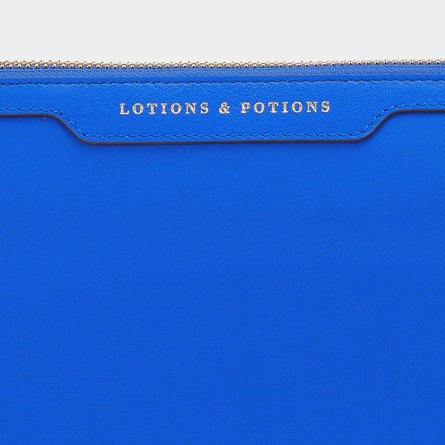 Lotions and Potions Pouch -

                  
                    ECONYL® in Electric Blue -
                  

                  Anya Hindmarch US
